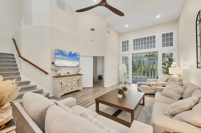 1719 Starling Dr Unit 1719, Sarasota, FL 34231 - living area with a high ceiling, stairway, a ceiling fan, wood finished floors, and recessed lighting