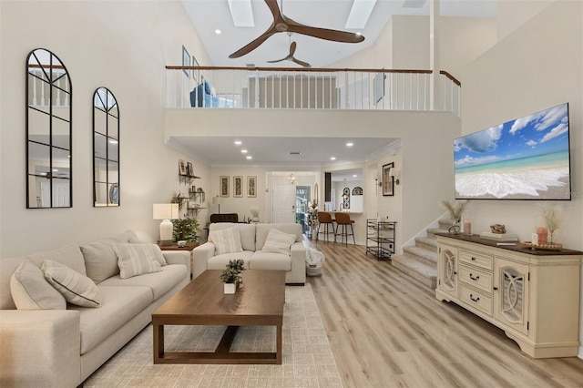 1719 Starling Dr Unit 1719, Sarasota, FL 34231 - living area featuring a towering ceiling, light wood finished floors, ceiling fan, and recessed lighting