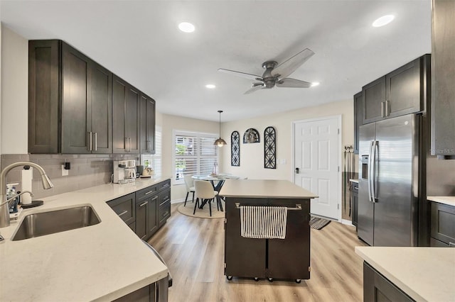 1719 Starling Dr Unit 1719, Sarasota, FL 34231 - kitchen with stainless steel fridge with ice dispenser, light wood-style floors, a ceiling fan, light countertops, and recessed lighting