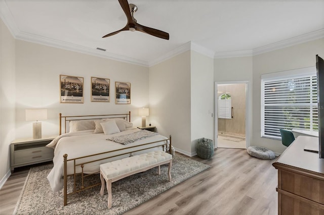 1719 Starling Dr Unit 1719, Sarasota, FL 34231 - bedroom featuring light wood-style floors, ornamental molding, ceiling fan, and connected bathroom