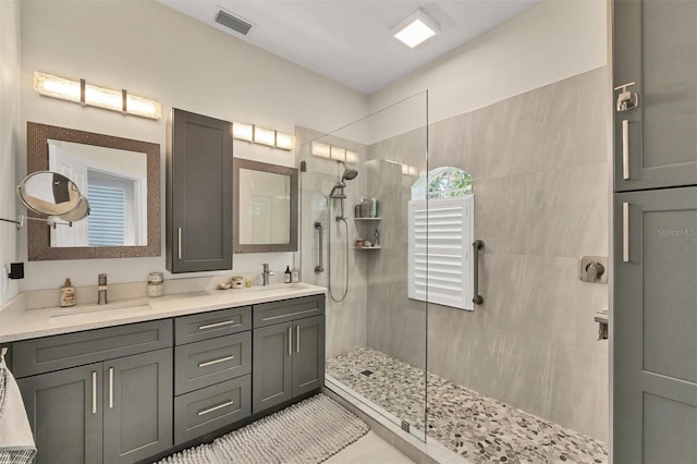 1719 Starling Dr Unit 1719, Sarasota, FL 34231 - bathroom featuring a walk in shower and double vanity