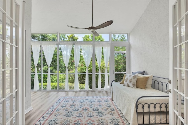 1719 Starling Dr Unit 1719, Sarasota, FL 34231 - sunroom with a textured wall, wood finished floors, and healthy amount of natural light