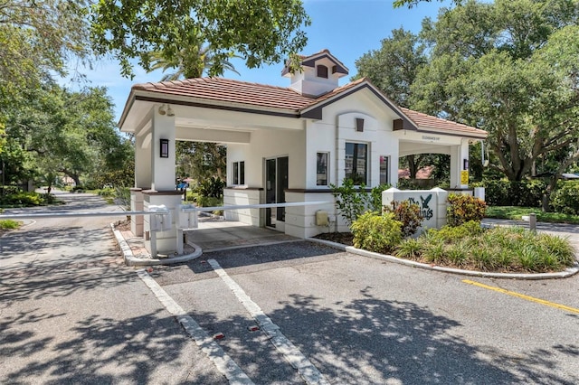 1719 Starling Dr Unit 1719, Sarasota, FL 34231 - view of front of home featuring a tiled roof and stucco siding