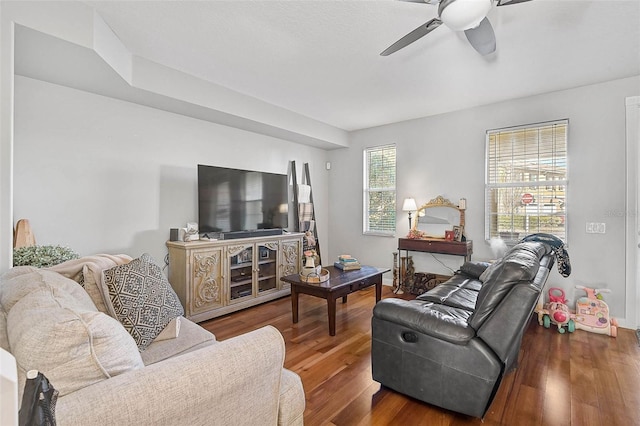 living room with ceiling fan and wood finished floors