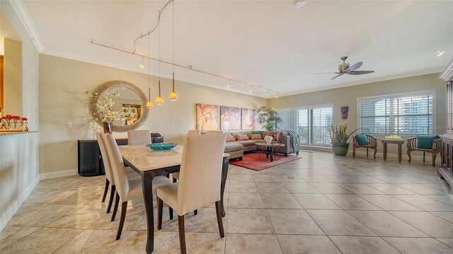 dining area featuring light tile patterned floors, baseboards, ceiling fan, ornamental molding, and track lighting