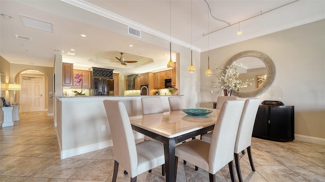 dining space featuring ornamental molding, visible vents, and baseboards