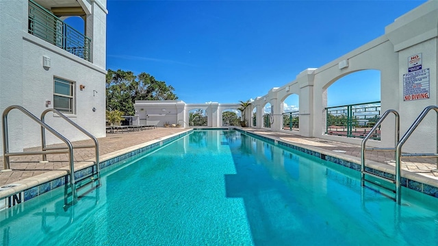 pool with a patio area