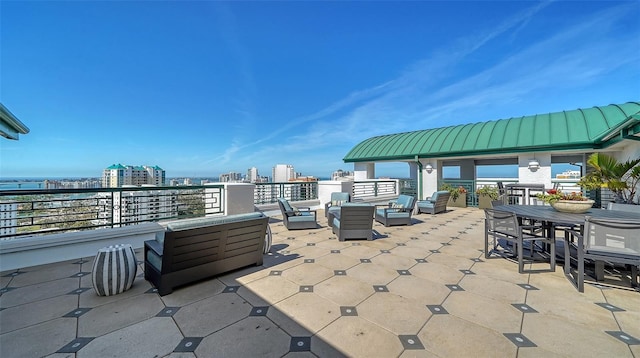 view of patio / terrace featuring an outdoor living space and a city view