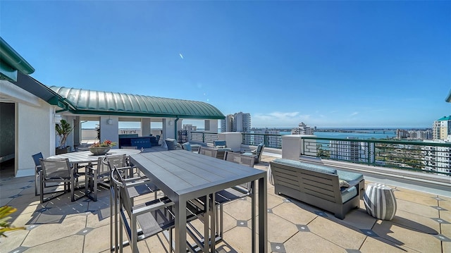 view of patio / terrace with a city view and outdoor dining space