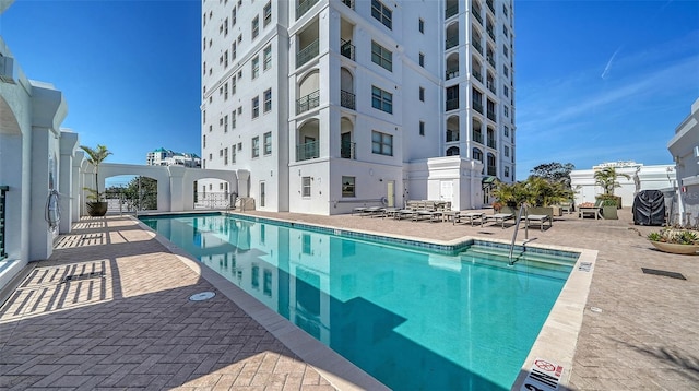 community pool featuring a patio