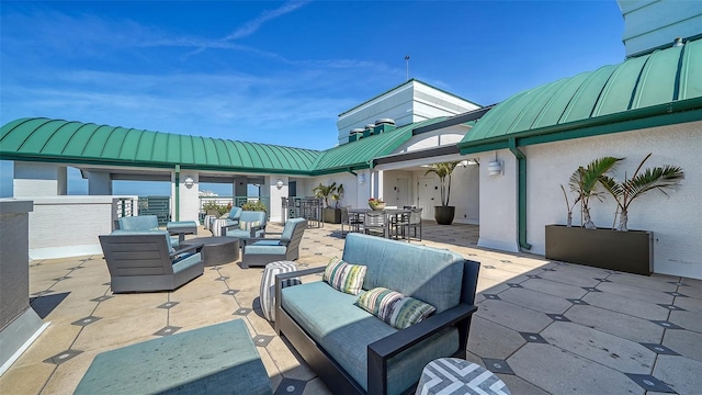 view of patio / terrace featuring outdoor dining area and an outdoor living space