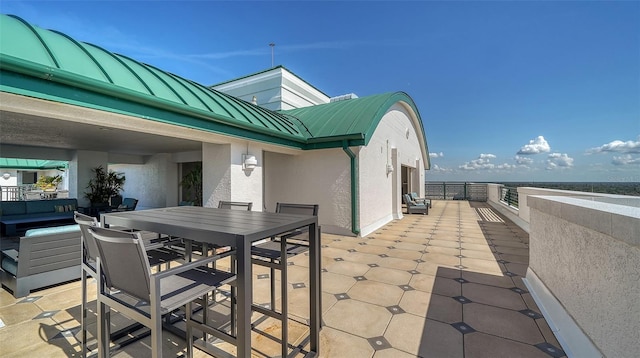 view of patio featuring outdoor dining area