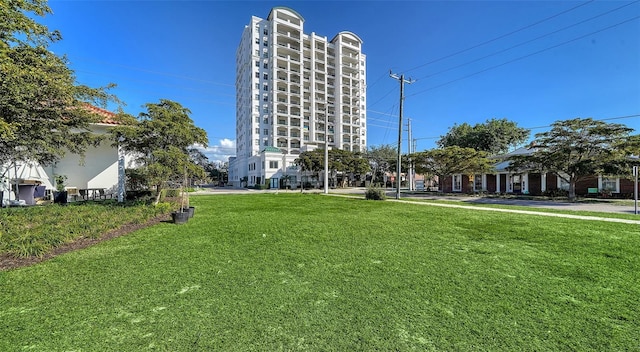 view of home's community featuring a lawn