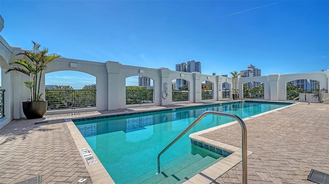 community pool with a patio