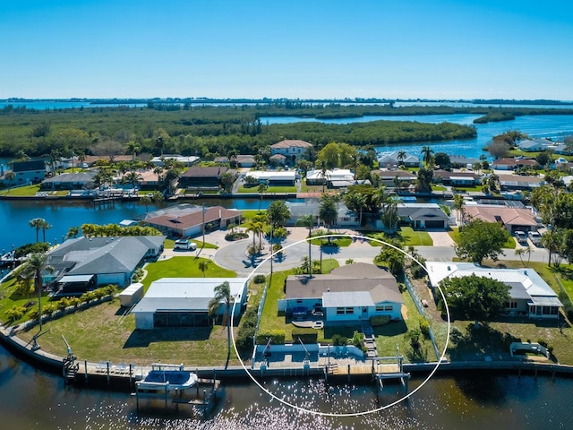 drone / aerial view with a residential view and a water view