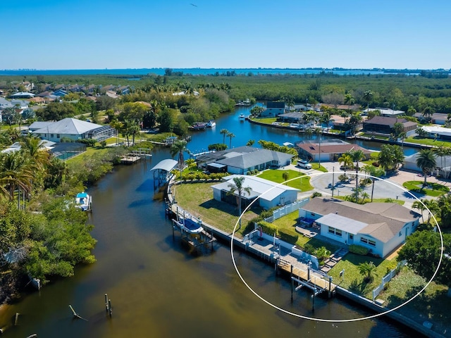 birds eye view of property featuring a water view and a residential view