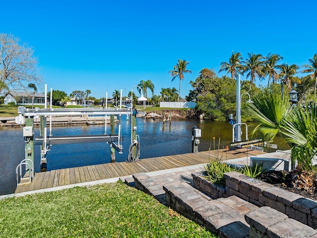 dock area featuring a water view and boat lift