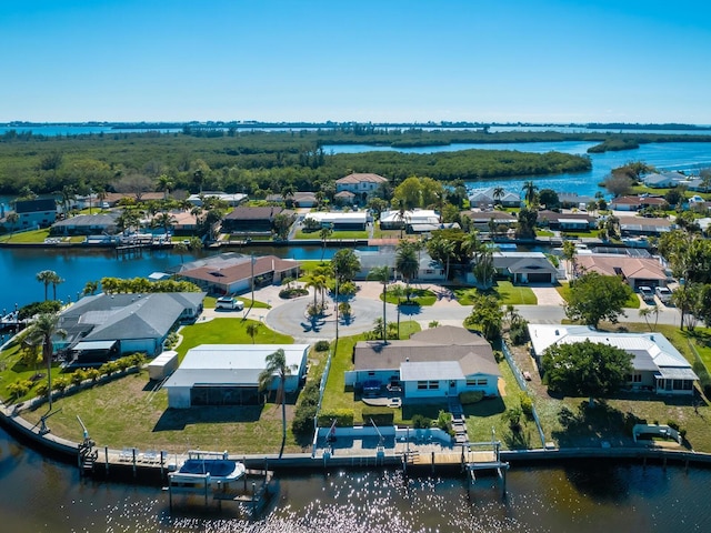 drone / aerial view with a water view and a residential view