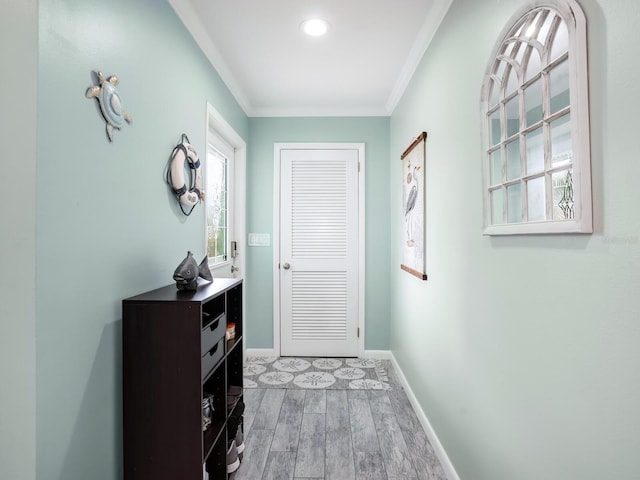 5303 Coral Blvd, Bradenton, FL 34210 - doorway to outside with crown molding, light wood-type flooring, and baseboards