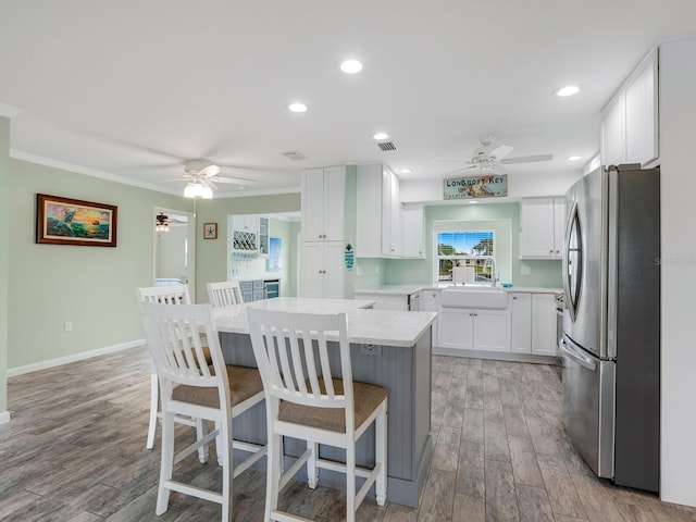 5303 Coral Blvd, Bradenton, FL 34210 - kitchen featuring a sink, light wood-type flooring, ceiling fan, and freestanding refrigerator