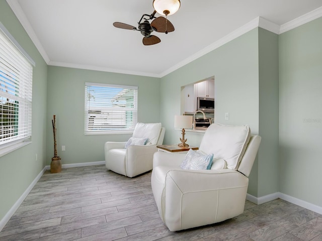 5303 Coral Blvd, Bradenton, FL 34210 - sitting room with light wood-type flooring, baseboards, a ceiling fan, and crown molding