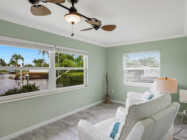 5303 Coral Blvd, Bradenton, FL 34210 - living area with baseboards, crown molding, a ceiling fan, and wood finished floors