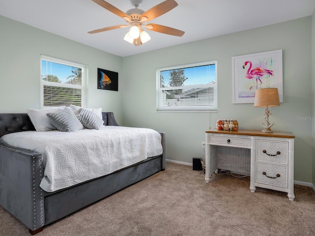 5303 Coral Blvd, Bradenton, FL 34210 - bedroom with light carpet, ceiling fan, and baseboards