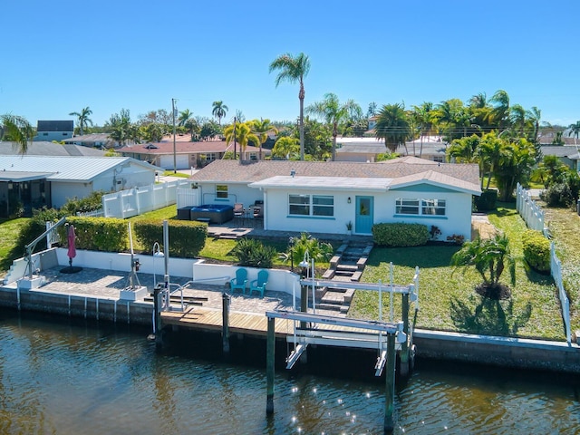 5303 Coral Blvd, Bradenton, FL 34210 - back of house featuring stucco siding, a fenced backyard, and a water view
