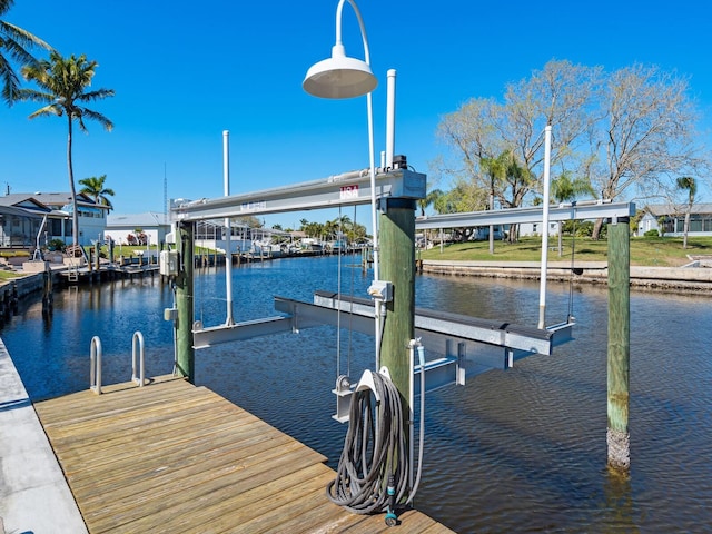 5303 Coral Blvd, Bradenton, FL 34210 - view of dock with boat lift and a water view