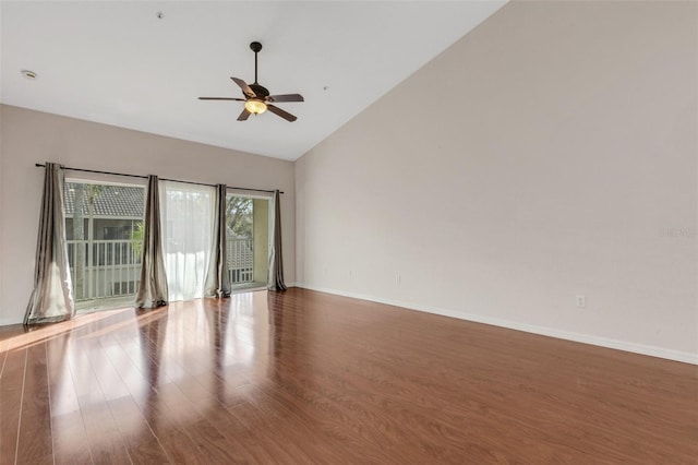 unfurnished room featuring hardwood / wood-style floors, high vaulted ceiling, and ceiling fan