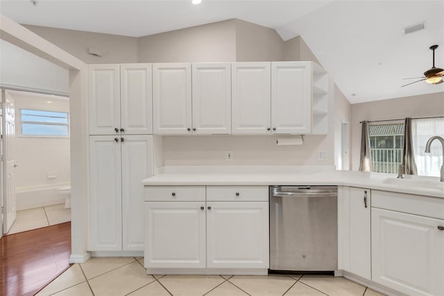 kitchen featuring sink, stainless steel dishwasher, and white cabinets