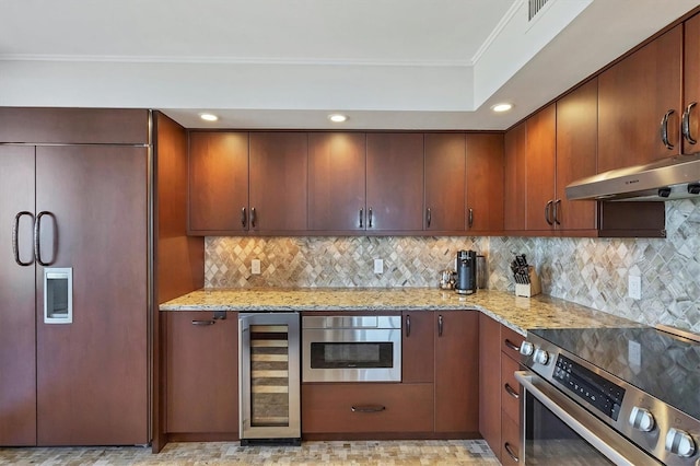 kitchen with stainless steel electric stove, beverage cooler, ornamental molding, paneled built in fridge, and light stone counters