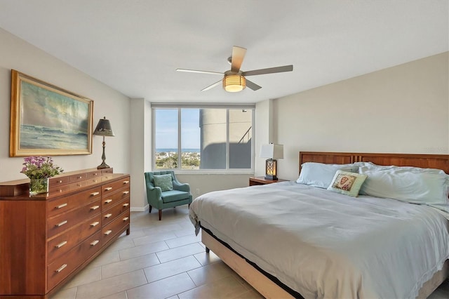 tiled bedroom with ceiling fan