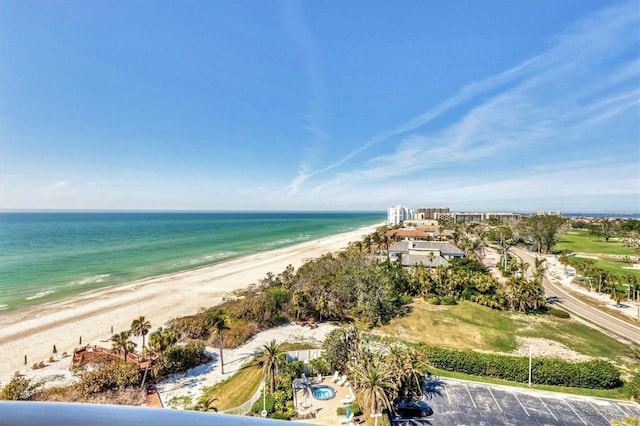 bird's eye view featuring a water view and a view of the beach