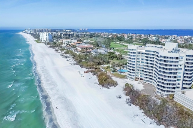 bird's eye view with a beach view and a water view