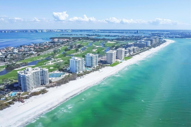 drone / aerial view with a water view and a view of the beach