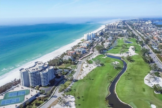 aerial view with a water view and a beach view