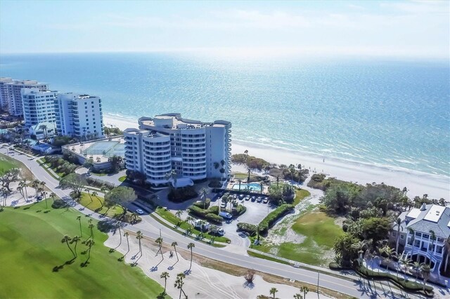 aerial view featuring a view of the beach and a water view