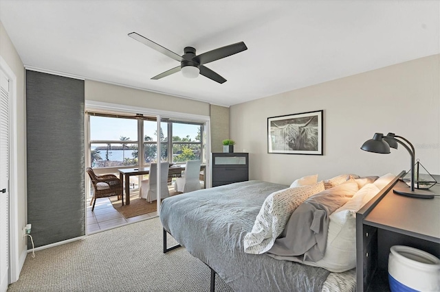 carpeted bedroom featuring access to outside and ceiling fan