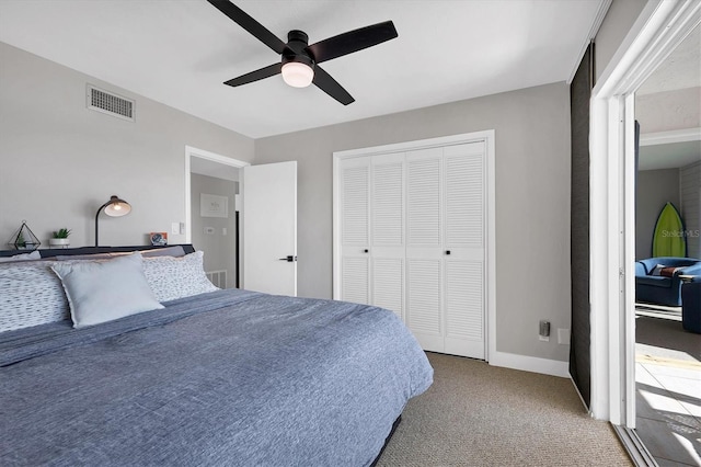 bedroom with ceiling fan, a closet, and carpet