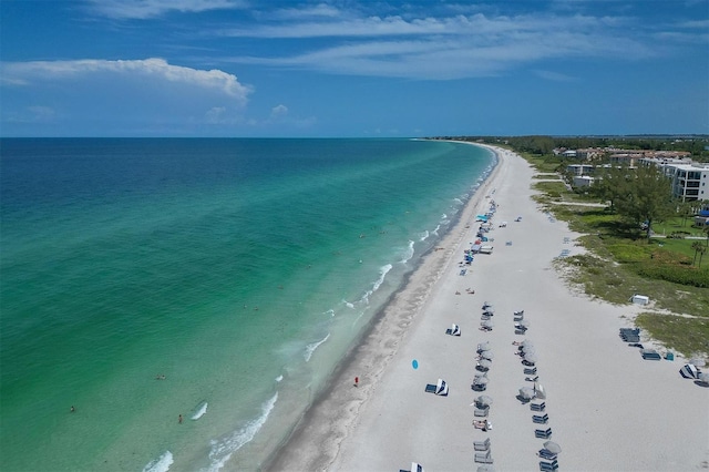 birds eye view of property with a view of the beach and a water view