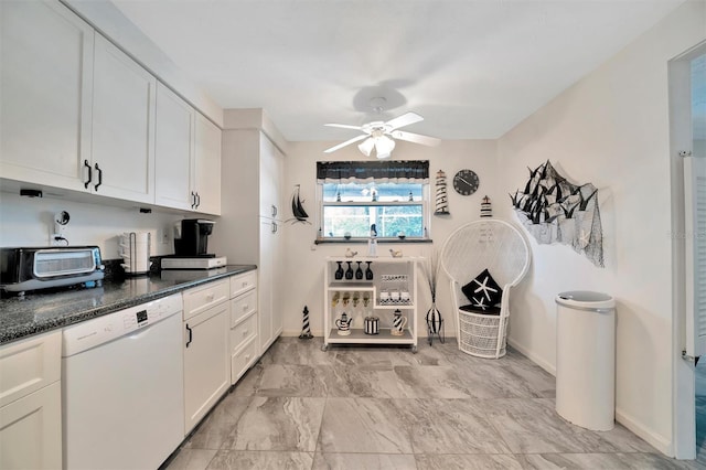 kitchen with white cabinetry, ceiling fan, dark stone countertops, and dishwasher