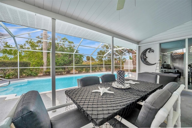 sunroom / solarium featuring vaulted ceiling