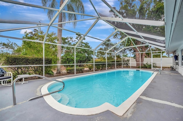 view of pool featuring a lanai and a patio