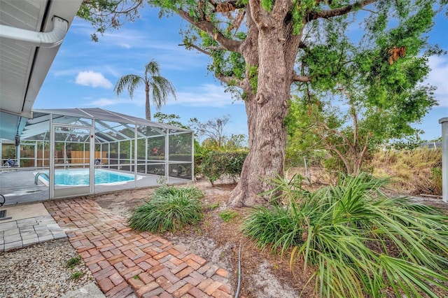 view of pool featuring a lanai and a patio area