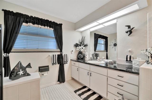 bathroom with vanity and tile patterned flooring