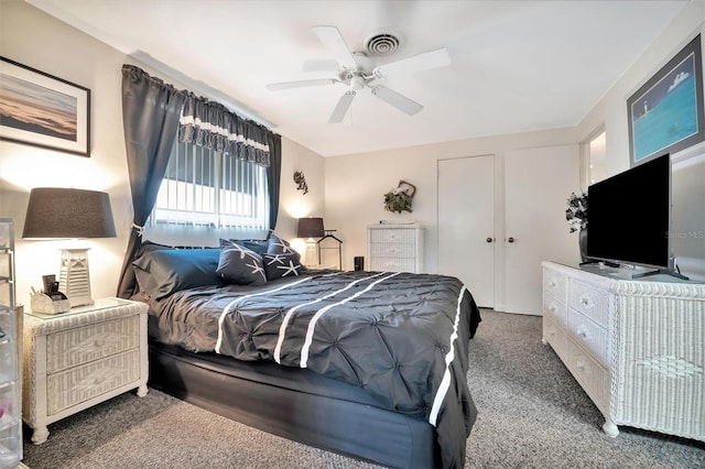 bedroom with ceiling fan and carpet