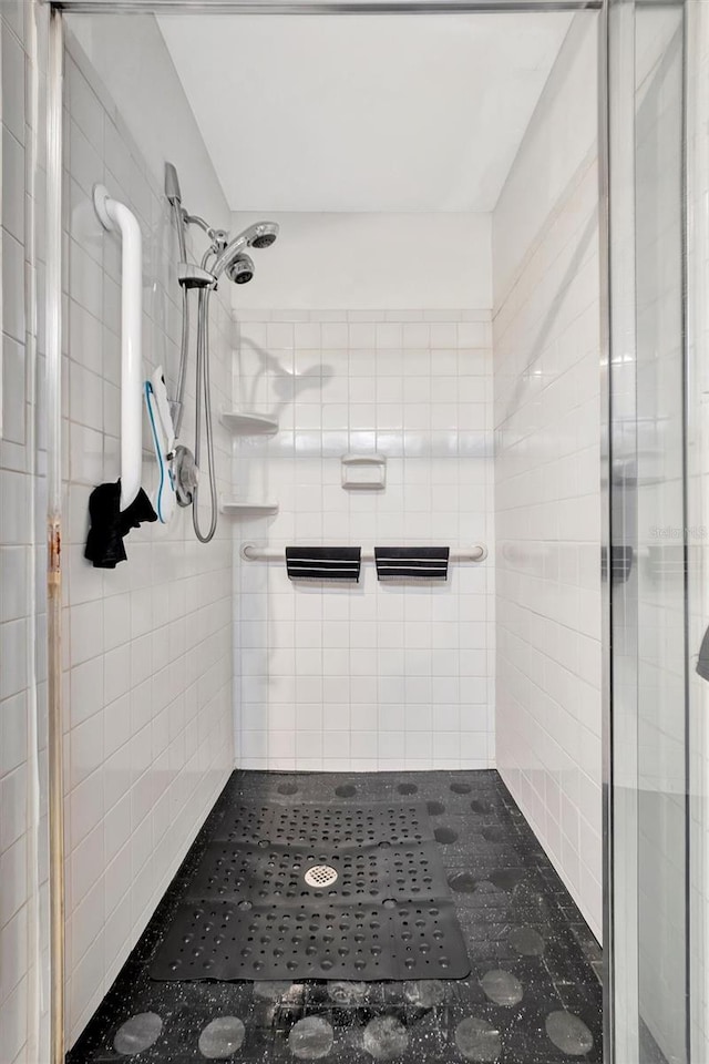 bathroom with tiled shower