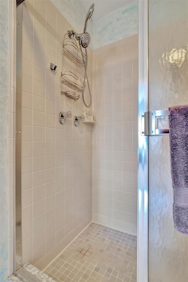 bathroom with a shower with shower door