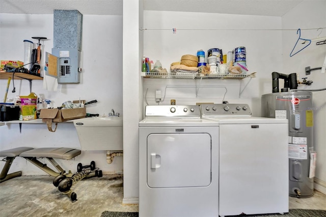 washroom with separate washer and dryer, sink, electric panel, and electric water heater